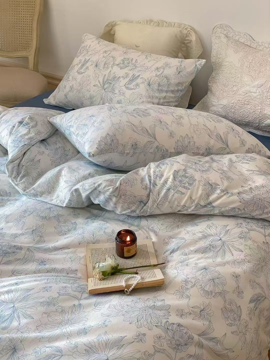 Charming blue and white floral bedding set with delicate patterns, offering a fresh, vintage-inspired look. Perfect for adding an antique floral touch to your bedroom décor.