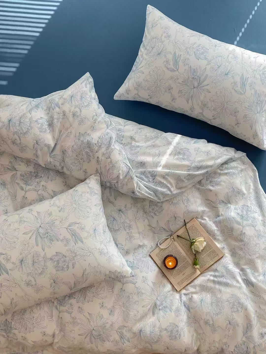 Elegant floral navy bedding set in queen size, featuring a stunning floral design for a sophisticated and serene bedroom ambiance.