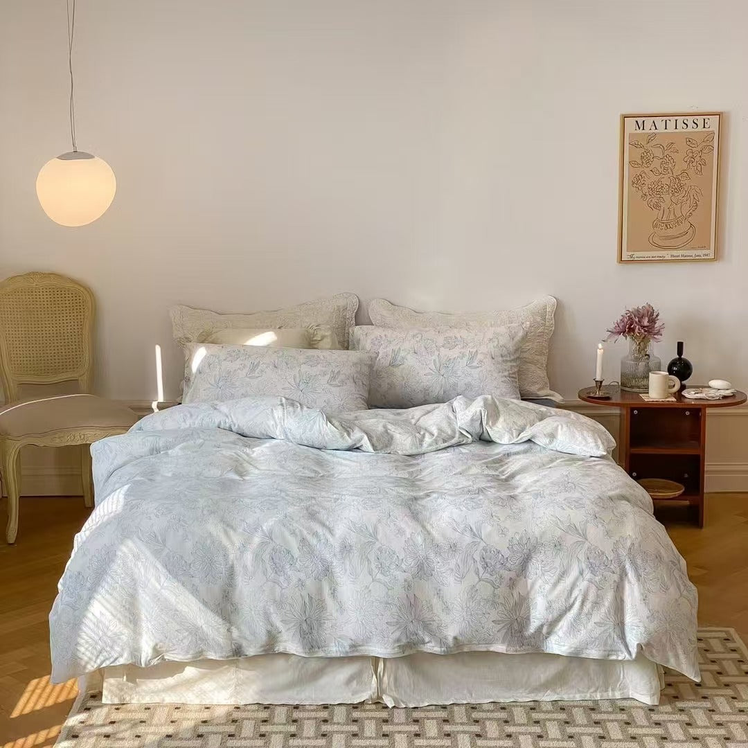 Soft blue floral bedding set made from breathable cotton knit fabric, featuring a beautiful floral pattern for a fresh and cozy bedroom aesthetic.