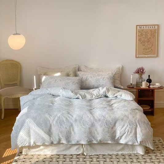 Soft blue floral bedding set made from breathable cotton knit fabric, featuring a beautiful floral pattern for a fresh and cozy bedroom aesthetic.