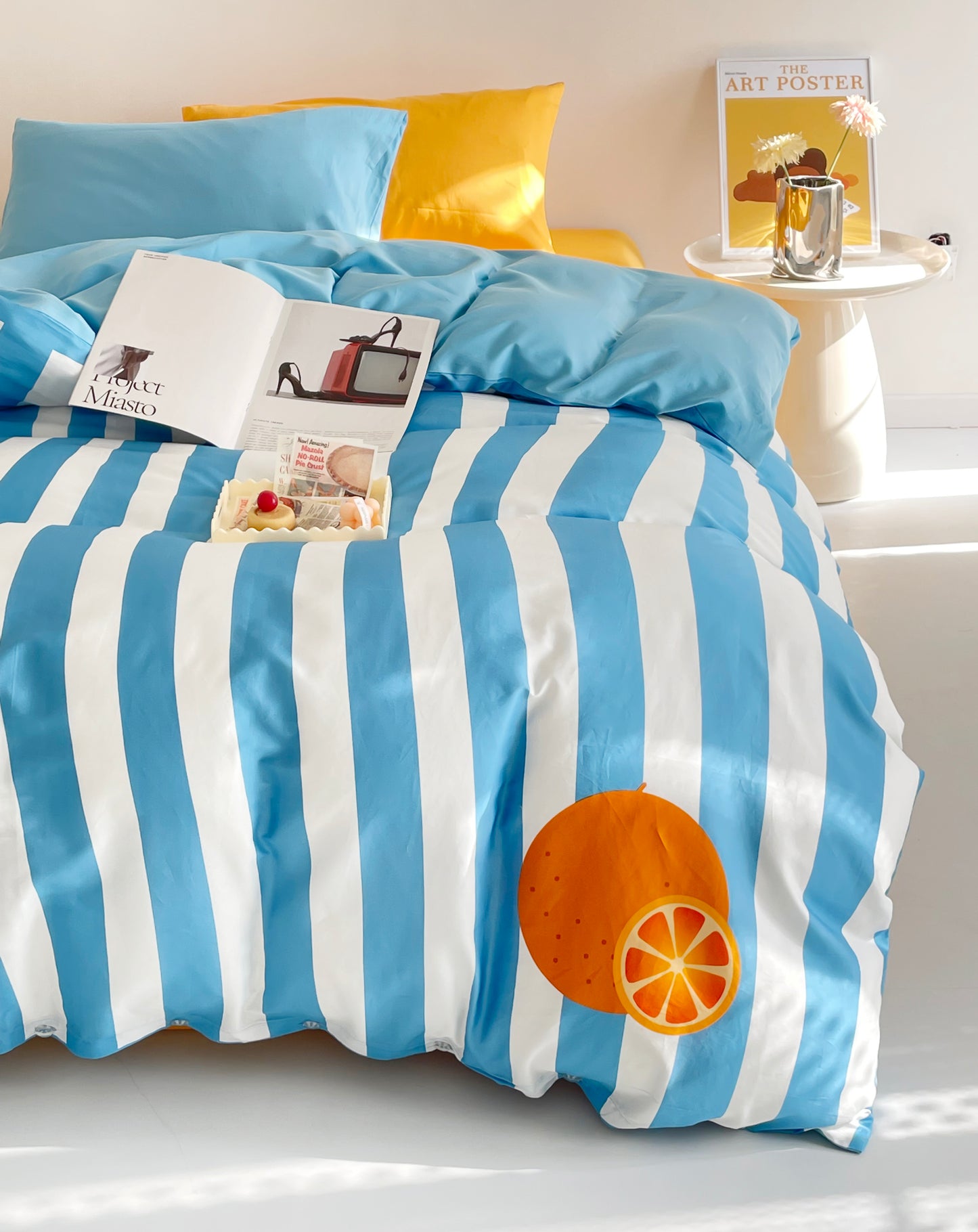 Bold color block bed sheets in blue and yellow, combining vibrant contrasts for a fresh and contemporary bedroom style.