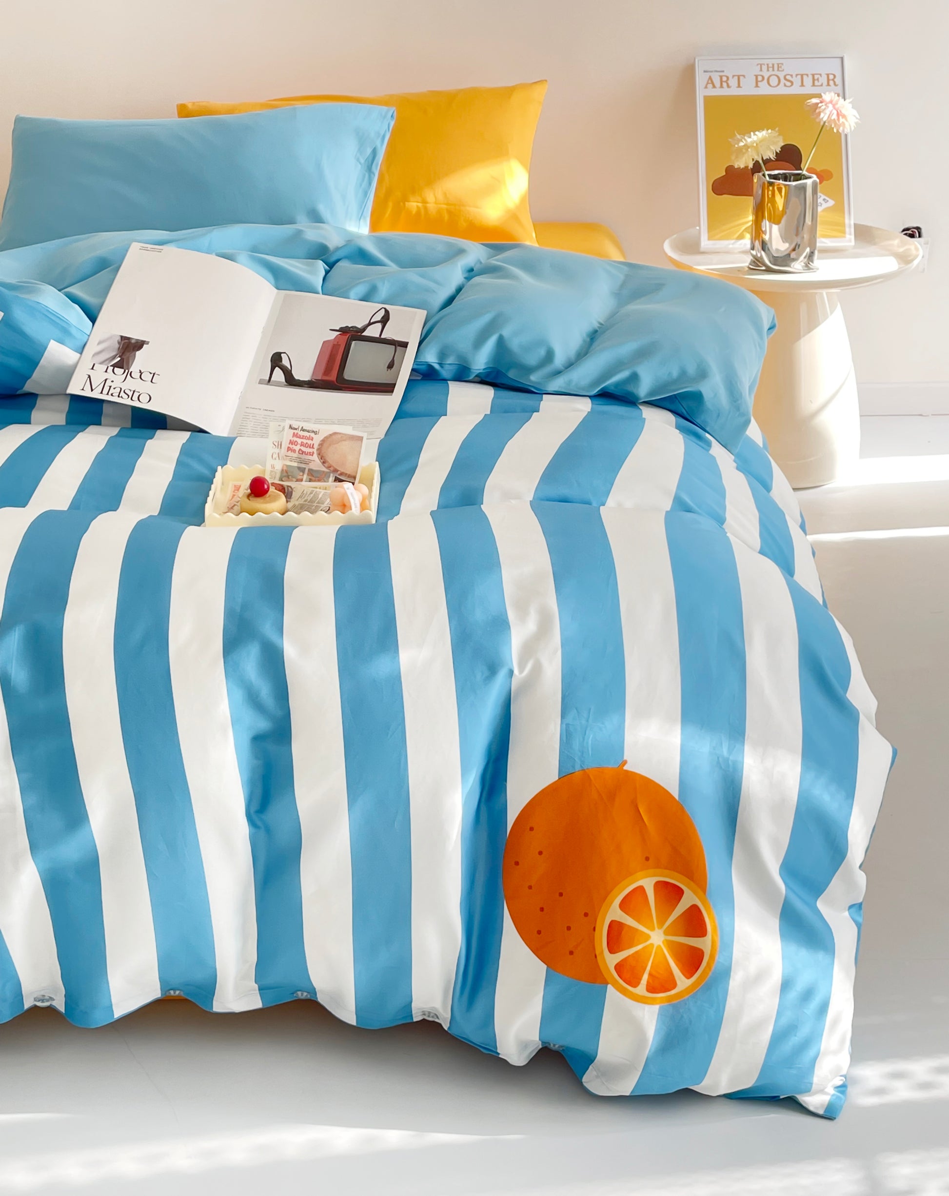 Bold color block bed sheets in blue and yellow, combining vibrant contrasts for a fresh and contemporary bedroom style.