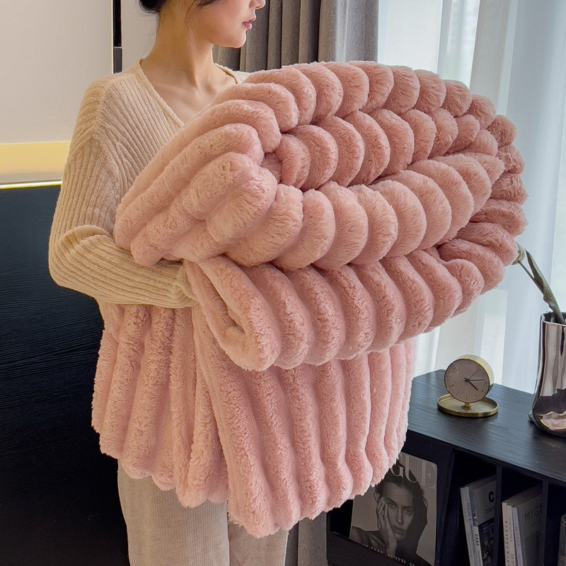 Soft pink faux fur blanket, a thin yet warm blanket that provides cozy comfort without the bulk, perfect for layering during cooler weather.