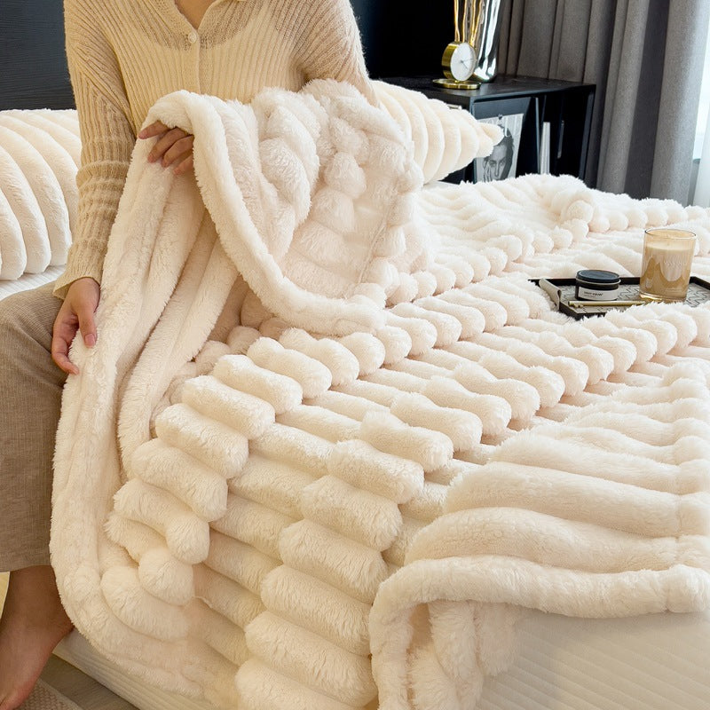 Luxuriously soft rabbit faux fur blanket, designed as a warming blanket to provide ultimate comfort and coziness during chilly days.