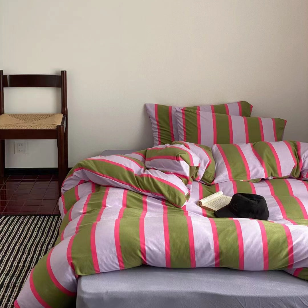 Pink striped bed sheets crafted from Valentine knit cotton fabric, offering a soft and romantic touch to your bedroom decor.