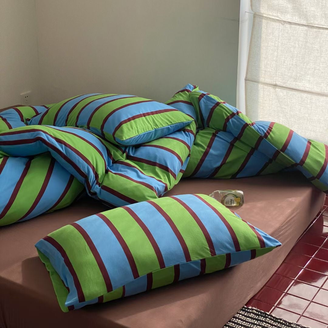 Striped bed set in vibrant tropical colors, bringing a fresh and lively style to your bedroom decor.