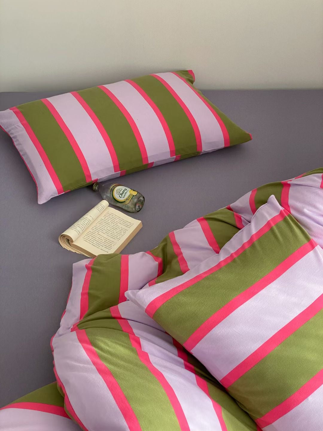 Purple striped bed sheet set, adding a touch of elegance and comfort to your bedroom decor.